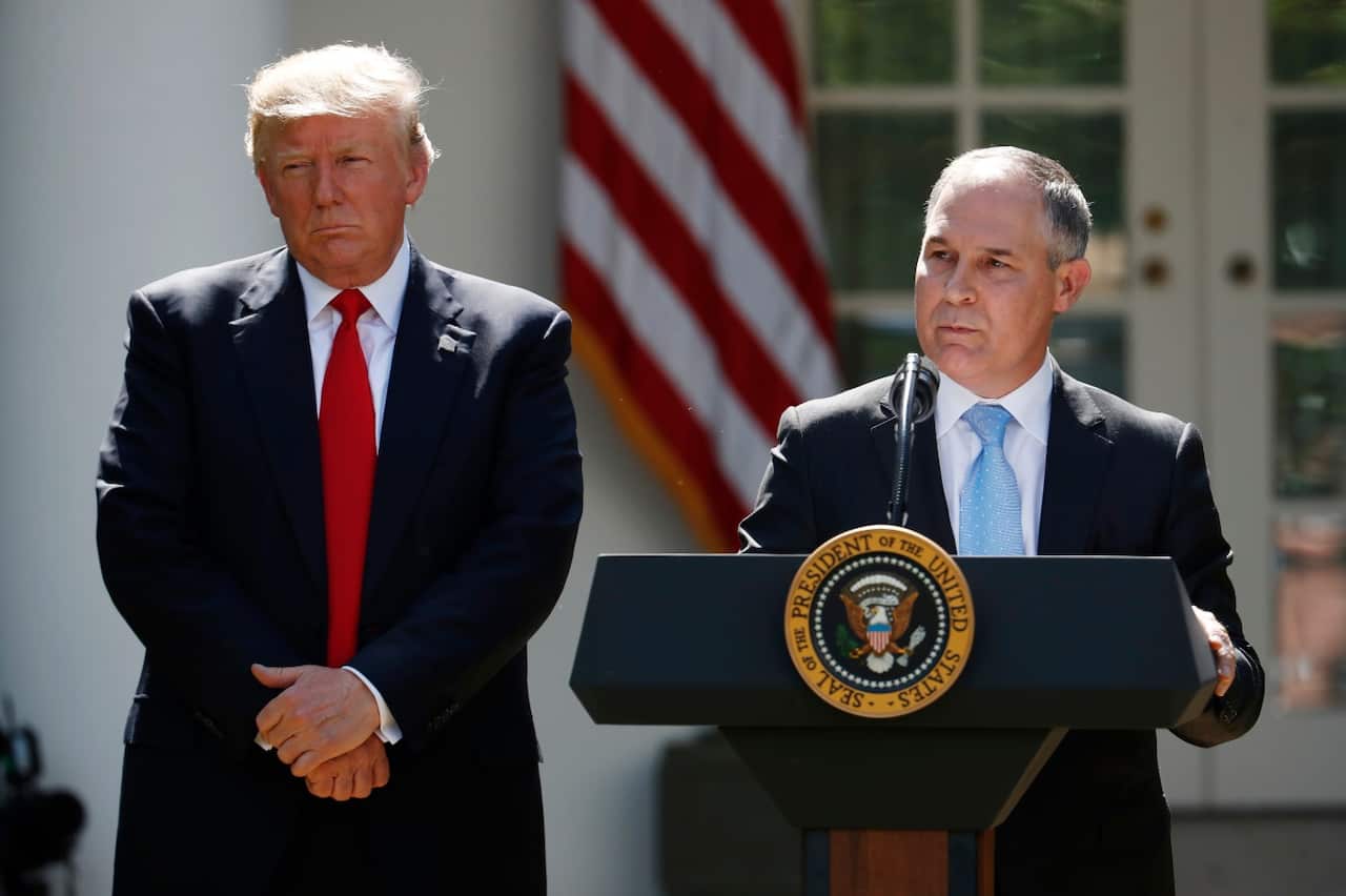 In this June 1, 2017, photo, President Donald Trump listens as EPA Administrator Scott Pruitt speaks about the U.S. role in the Paris climate change accord