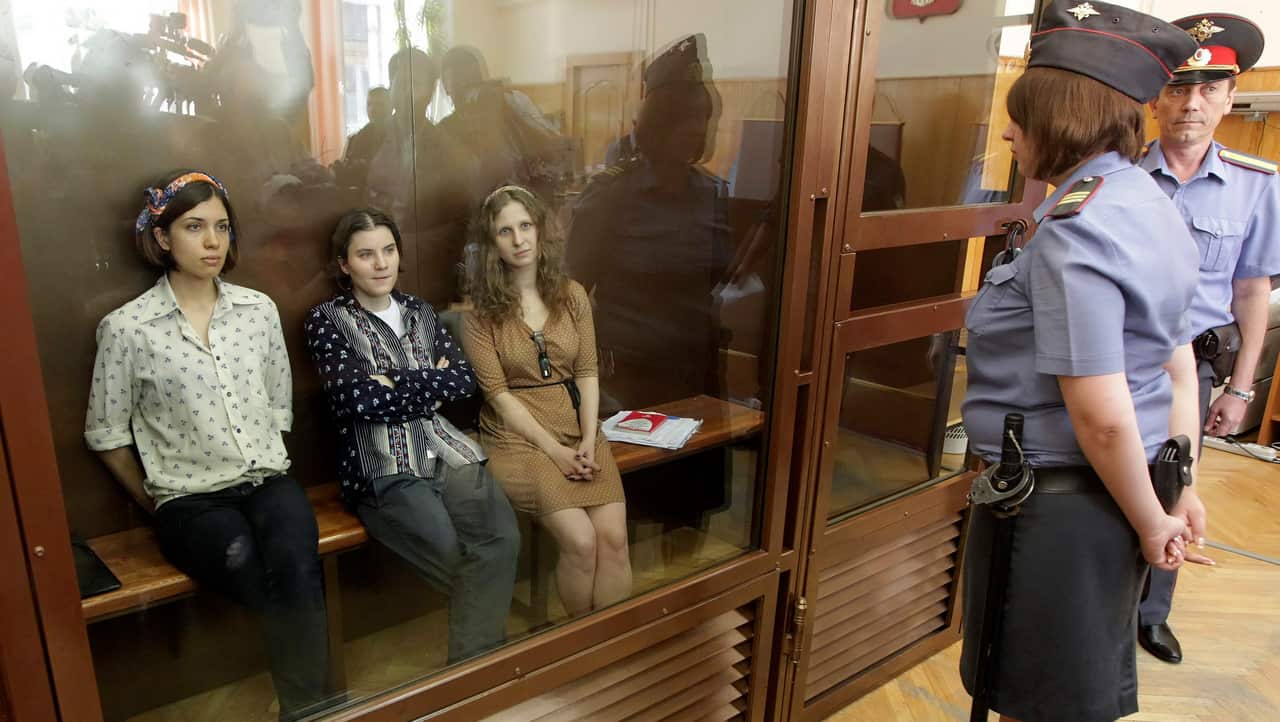 Pussy Riot Nadezhda Tolokonnikova (L), Yekaterina Samutsevich (C) and Maria Aliokhina (R) face court.