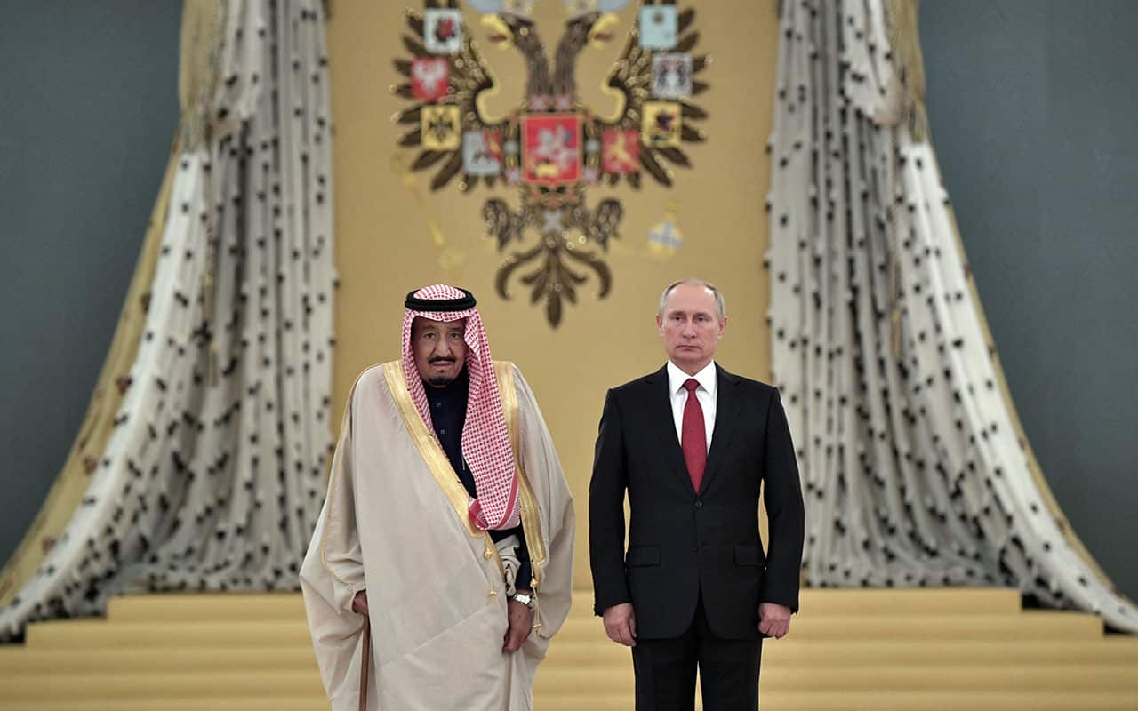 Russian President Vladimir Putin, right, and Saudi King Salman listen to national anthems during their meeting in Kremlin, Moscow.