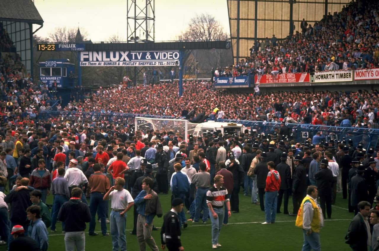 Supporters came onto the field following the disaster (Getty)