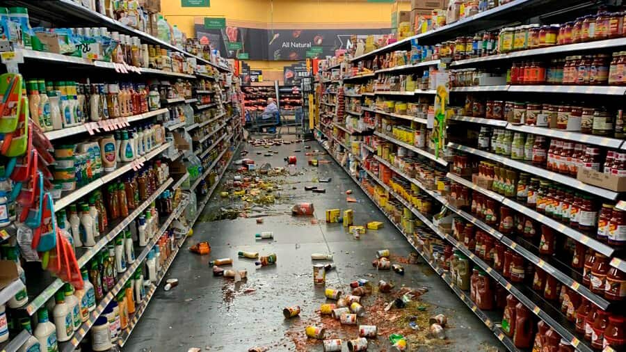 Food that fell from the shelves litters the floor of an aisle at a Walmart following an earthquake in Yucca Yalley, California.