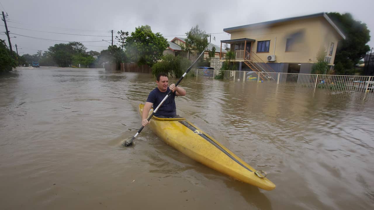 Graham Crighton kayaking in flood waters in Hermit Park Townsville on 3/2/19.