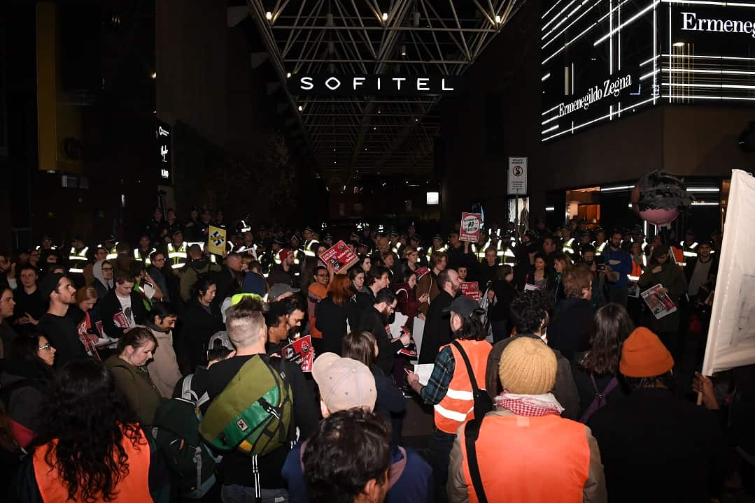 Activists from the Campaign Against Racism and Fascism outside Melbourne's Sofitel Hotel.