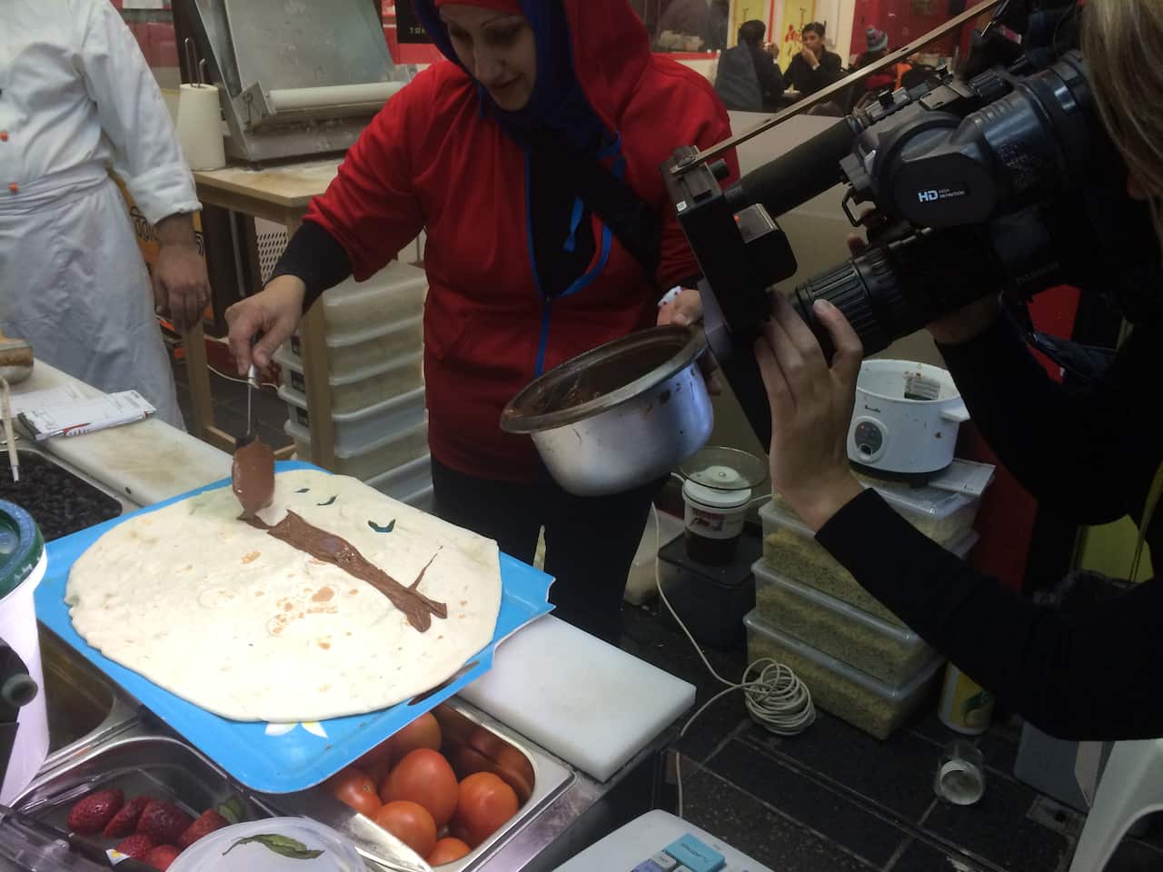Putting Nutella on Saj bread (SBS)