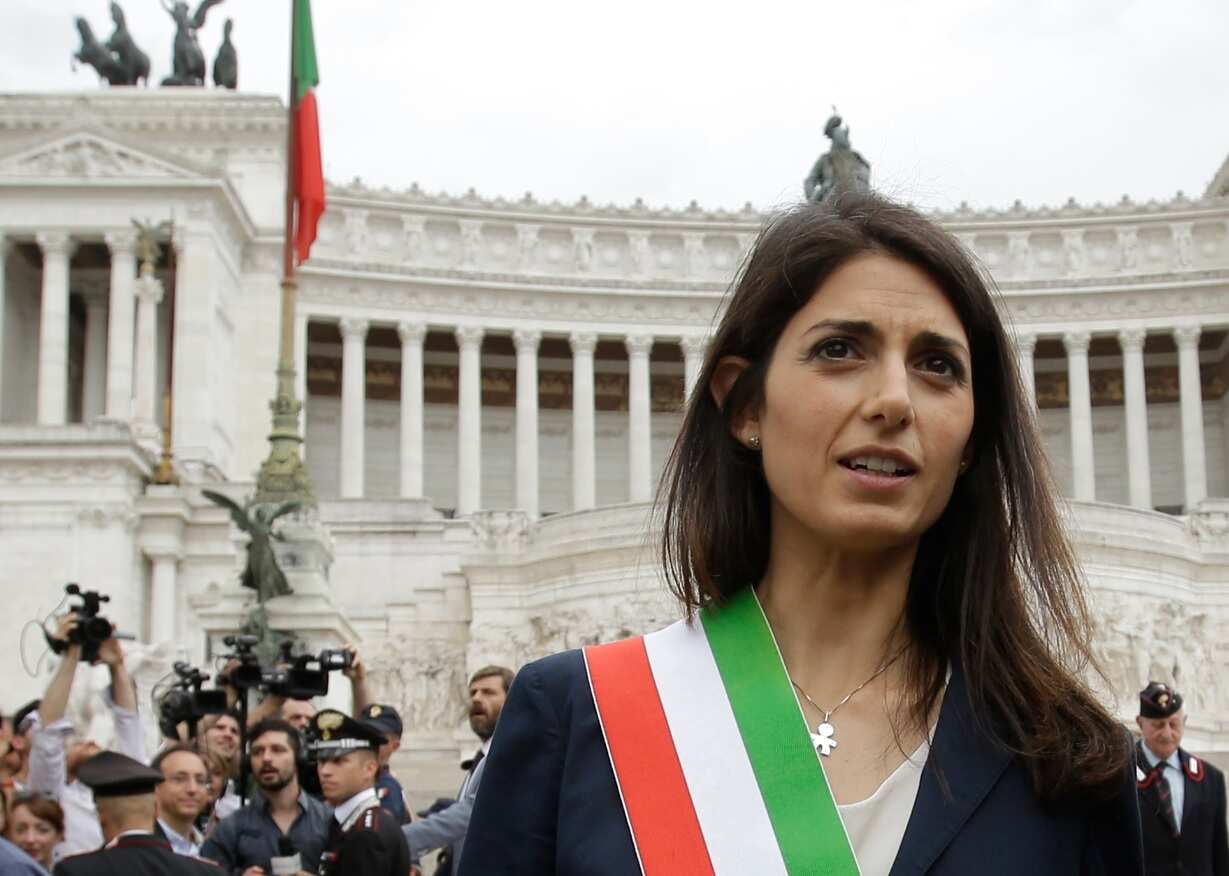 In this Thursday, June 23, 2016 filer, Rome's Mayor Virginia Raggi leaves Rome's Vittoriano Unknown soldier monument