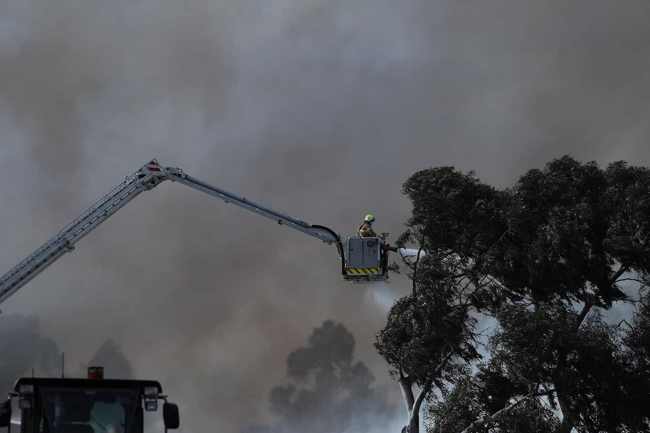 Fire crews work to put out a huge blaze at Coolaroo recycling centre in Melbourne on Thursday, July 13, 2017. 