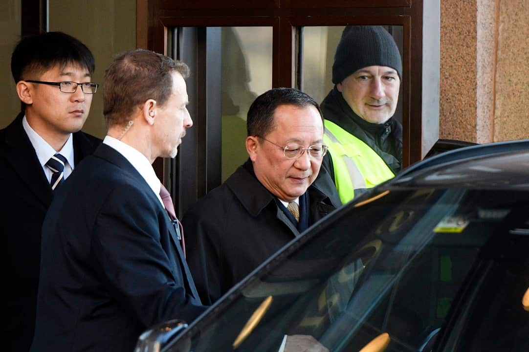 The North Korean Foreign Minister Ri Yong Ho, centre, leaves the Swedish goverment building.