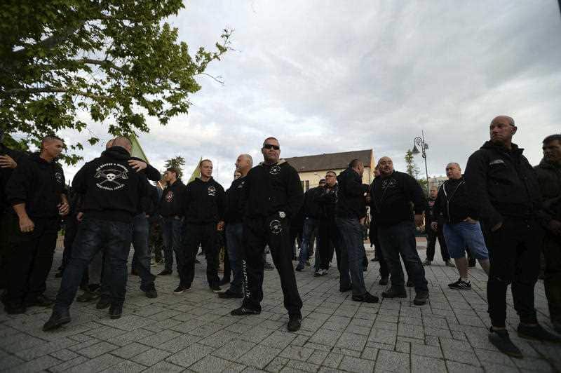 Supporters of the Hungarian far-right party Mi Hazank Mozgalom wait for their leader to speak. The group had planned a march on Roman neighbourhoods. 