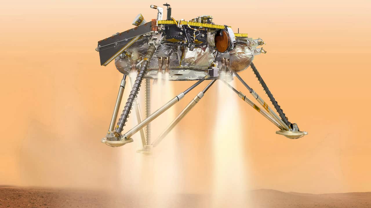 An illustration showing a simulated view of NASA's InSight lander about to land on the surface of Mars.