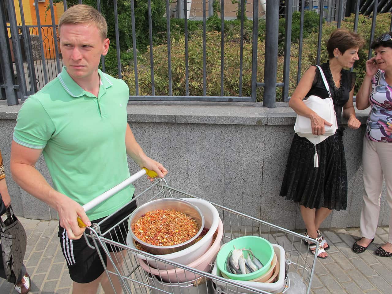 A zookeeper at the Moscow Zoo brings food to the zoo’s storks