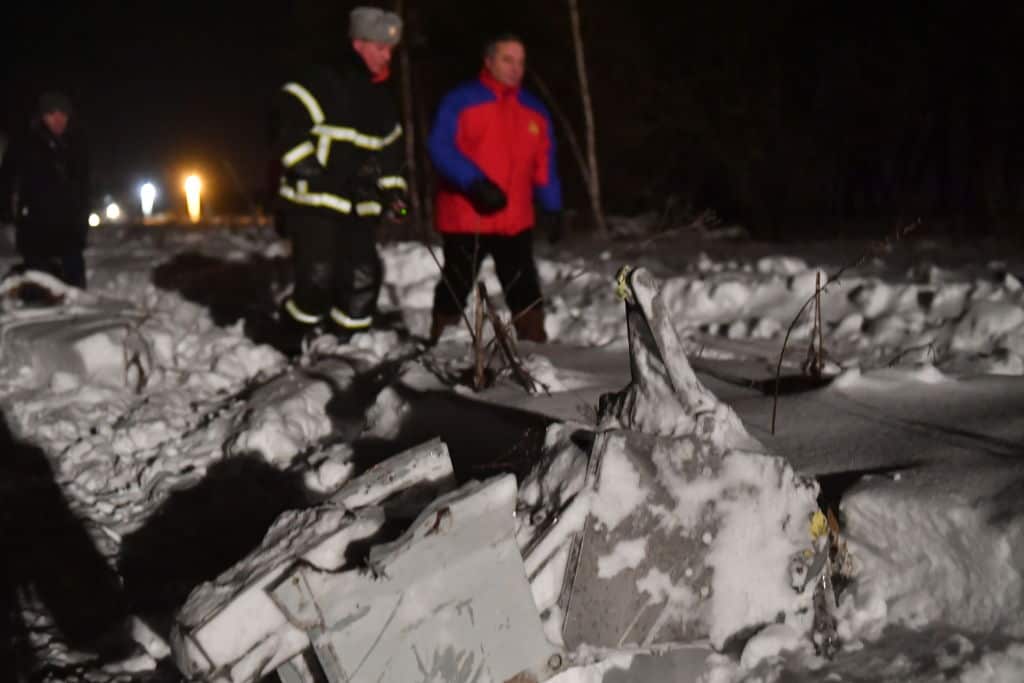 Russia's Emergency Situations Minister Vladimir Puchkov (R) at the crash site of a Saratov Airlines Antonov An-148 plane. 