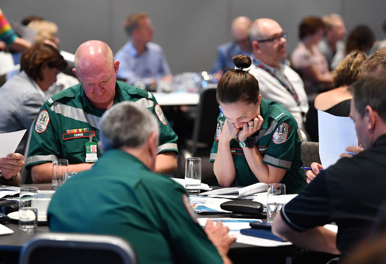 South Australian Health officials are seen during a meeting at the Pullman Hotel in Adelaide 10 March 2020.