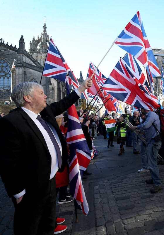 Unionist demonstrators hold a counter-protest as pro-independence supporters take part in a march organised by the All Under One Banner group.