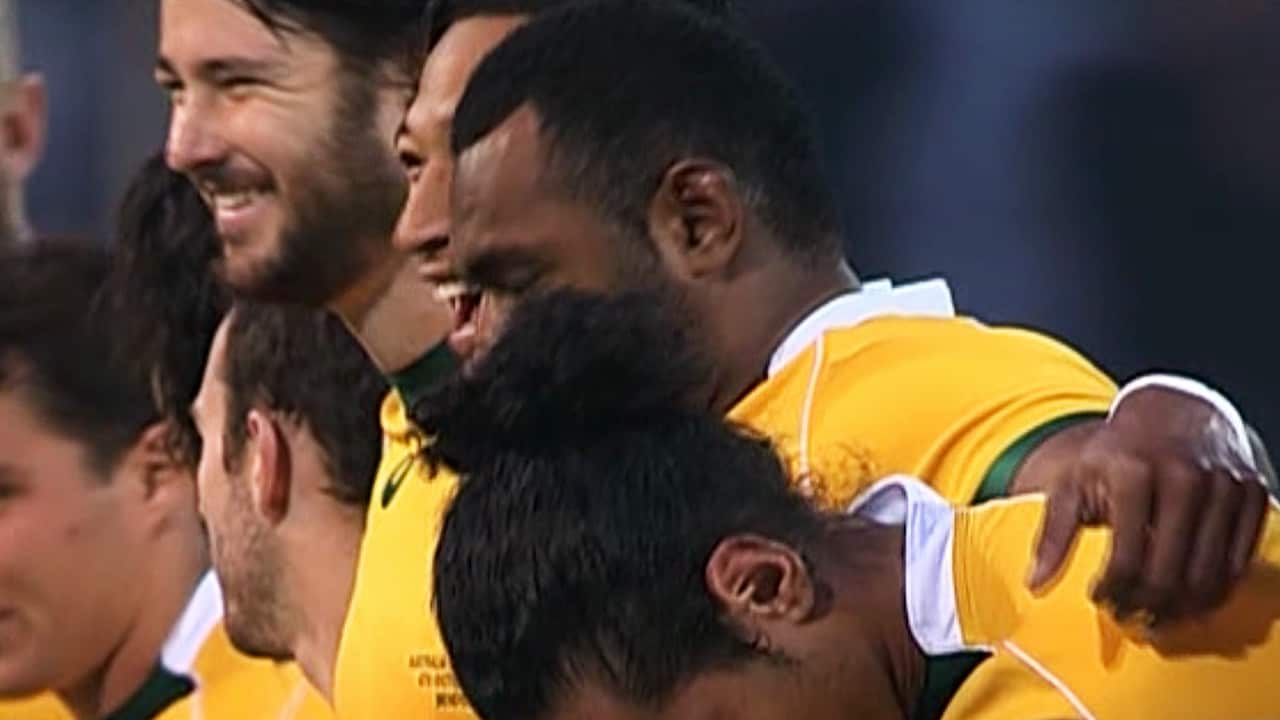 Wallabies players laugh after the singing of the Australian National Anthem.