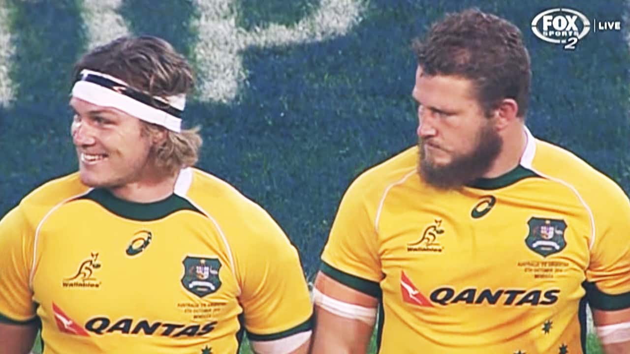 Wallabies players look bemused after the singing of the Australian National Anthem.