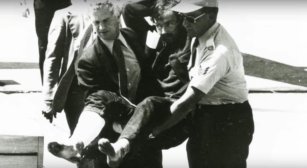 Police carry away an injured Edwin Eastwood.