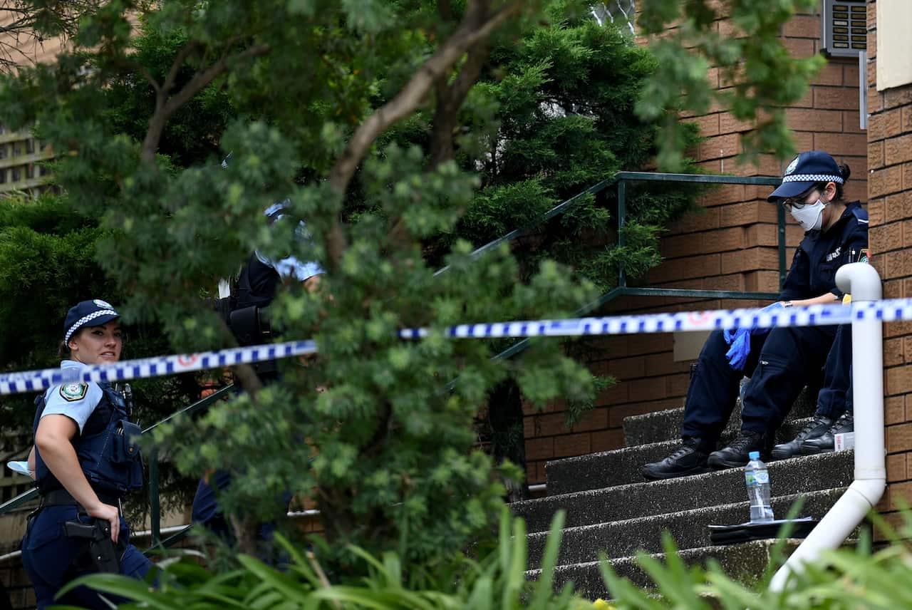 NSW Police officers at the scene where a woman was found dead inside an apartment at North Parramatta, Sydney, 31 January, 2022. 
