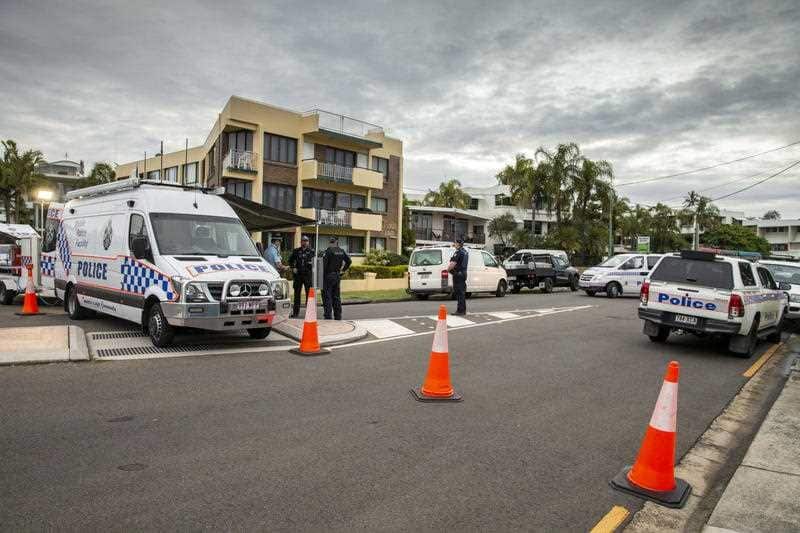 Police have surrounded the wanted man's unit in the ALexandra Heads on the Sunshine Coast.