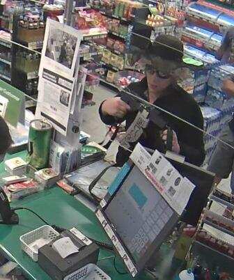 Victoria police are on the hunt for a man who robbed a petrol station while dressed as a woman. (Supplied)