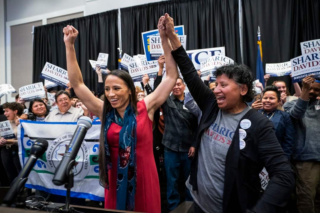Sharice Davids and her mum Crystal celebrate Davids victory.