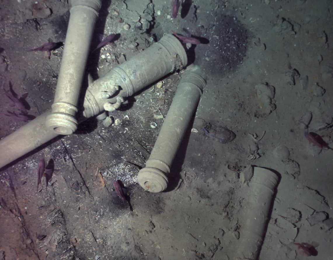 This November 2015 photo released Monday, May 21, 2018, by the Woods Hole Oceanographic Institution shows cannons from the 300-year-old shipwreck 