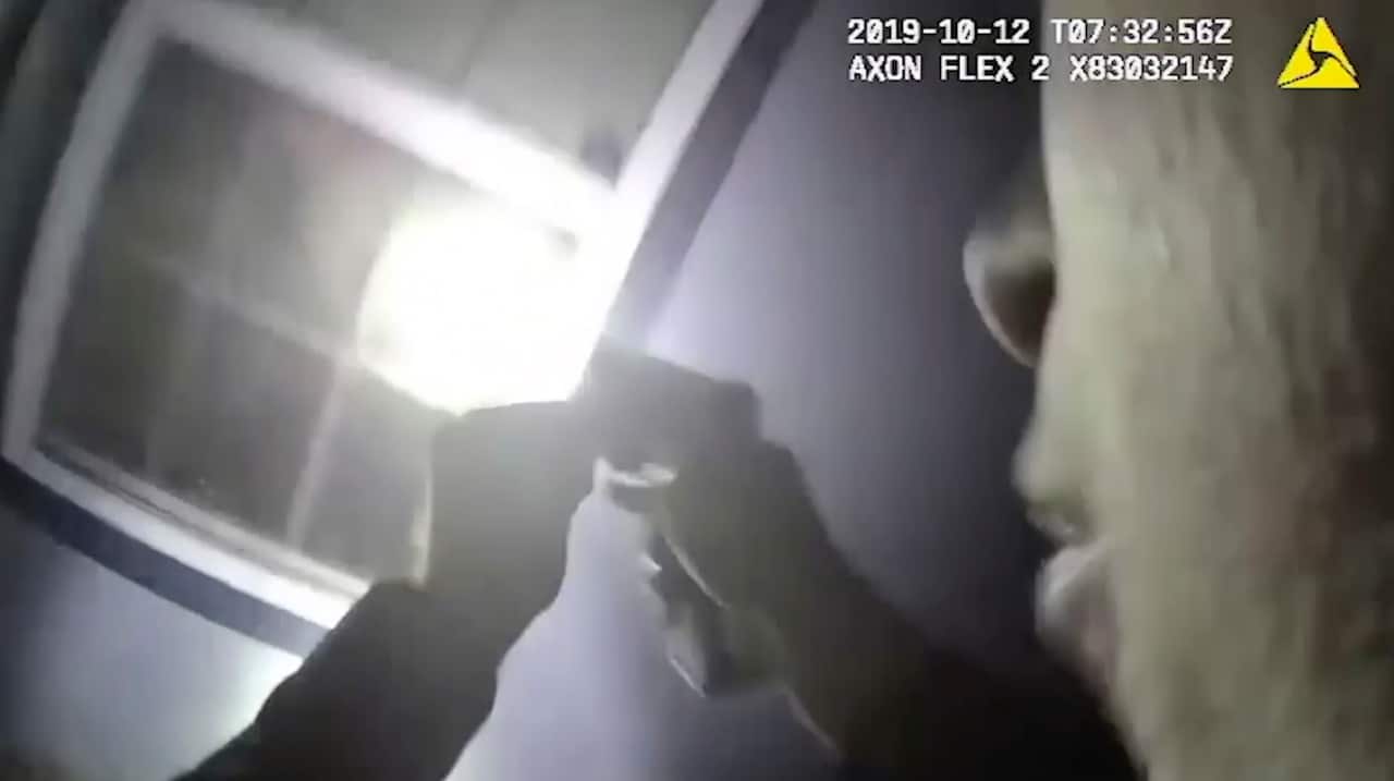 Body camera video released by the Fort Worth Police Department showing an officer shining a torch into a window in Fort Worth, Texas. 