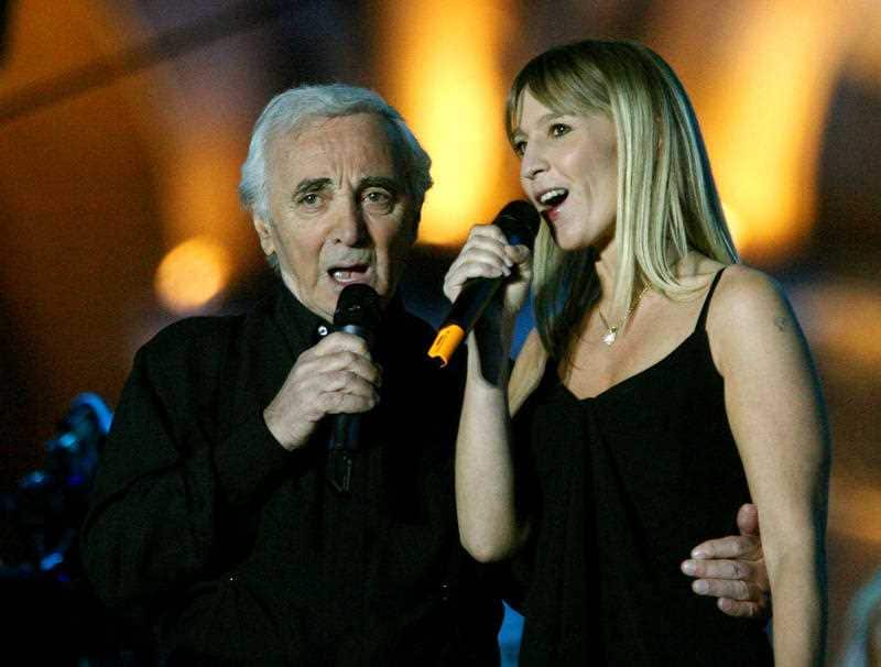 Charles Aznavour, left, and his daughter Katia Aznavour perform during their concert on the "place de la Republique" in Yerevan, Armeni, in 2006.