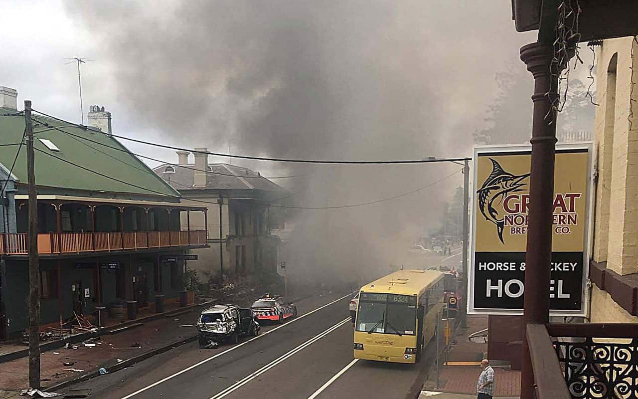 The truck crashed into several cars and buildings in Singleton, NSW. 