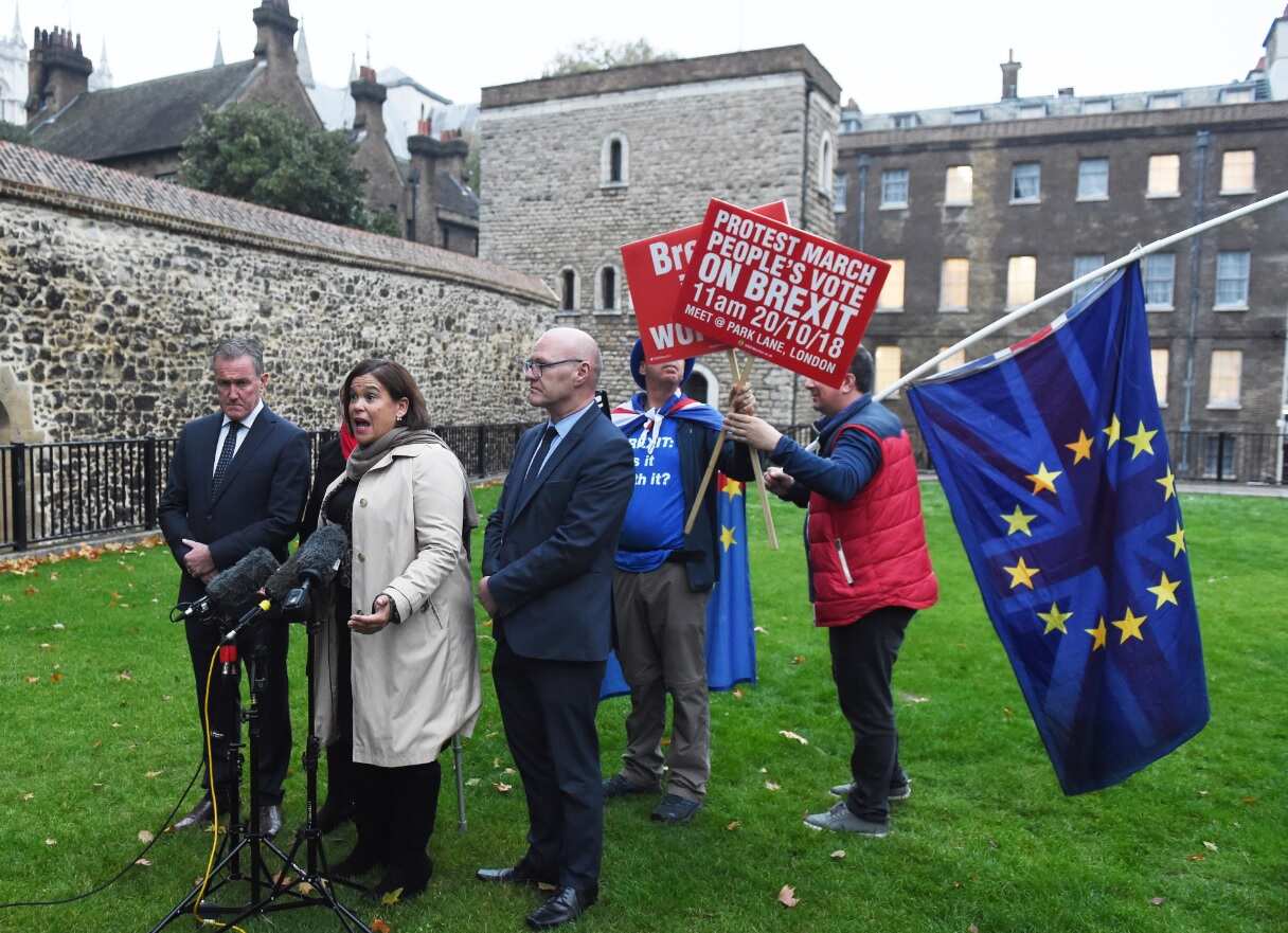 Sinn Fein's Conor Murphy (L) Sinn Fein Leader Mary Lou McDonald (C) and Michelle O'Neill, Sinn Fein's leader in Northern Ireland (C-L) speak to reporters