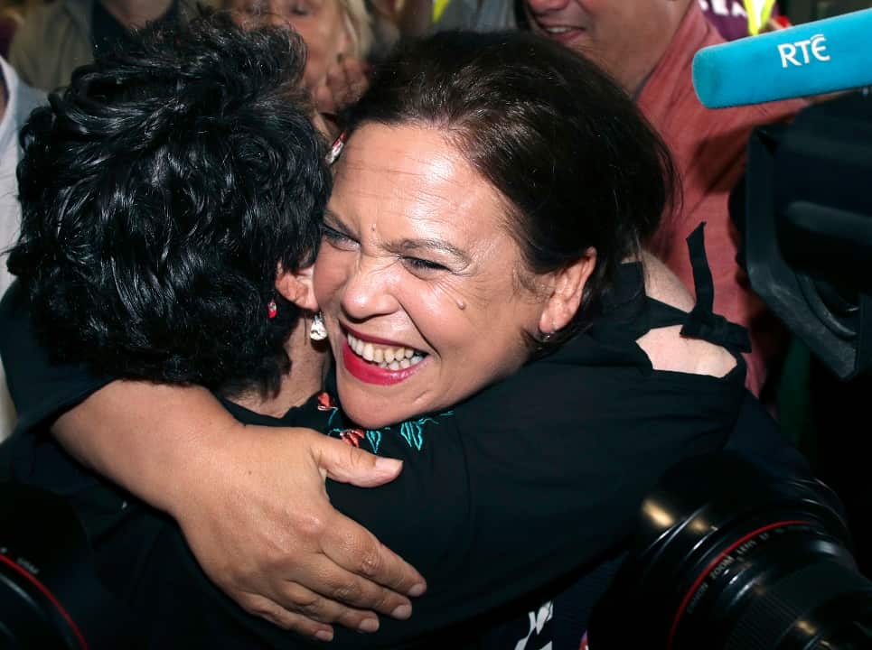 Sinn Fein leader Mary Lou McDonald, centre, celebrates with people from the "Yes" campaign.
