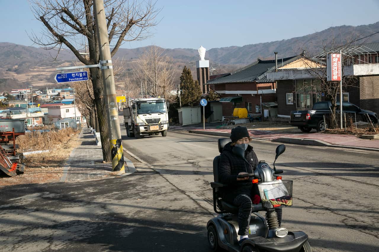 An elderly resident on a mobility scooter in Haean, South Korea, a village on the North Korean border, Dec. 24, 2020.