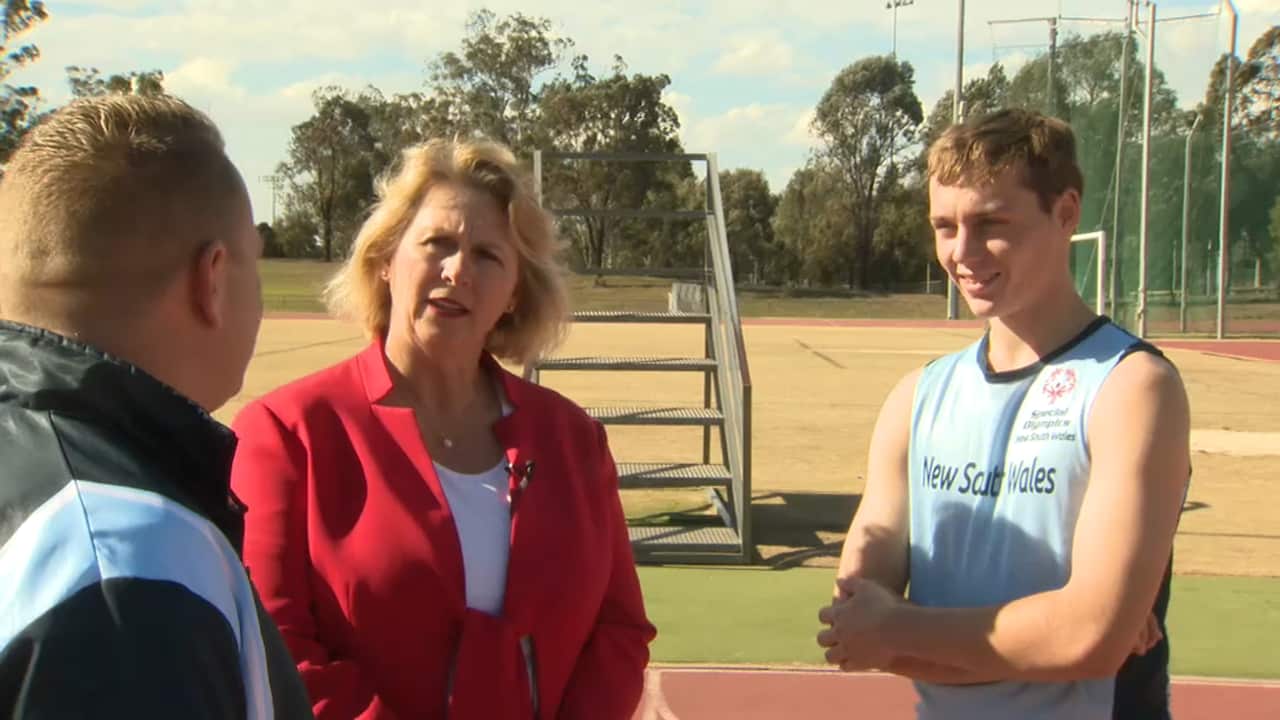 Special Olympics Australia CEO with athlete Lleyton Lloyd and coach Marc Ferguson