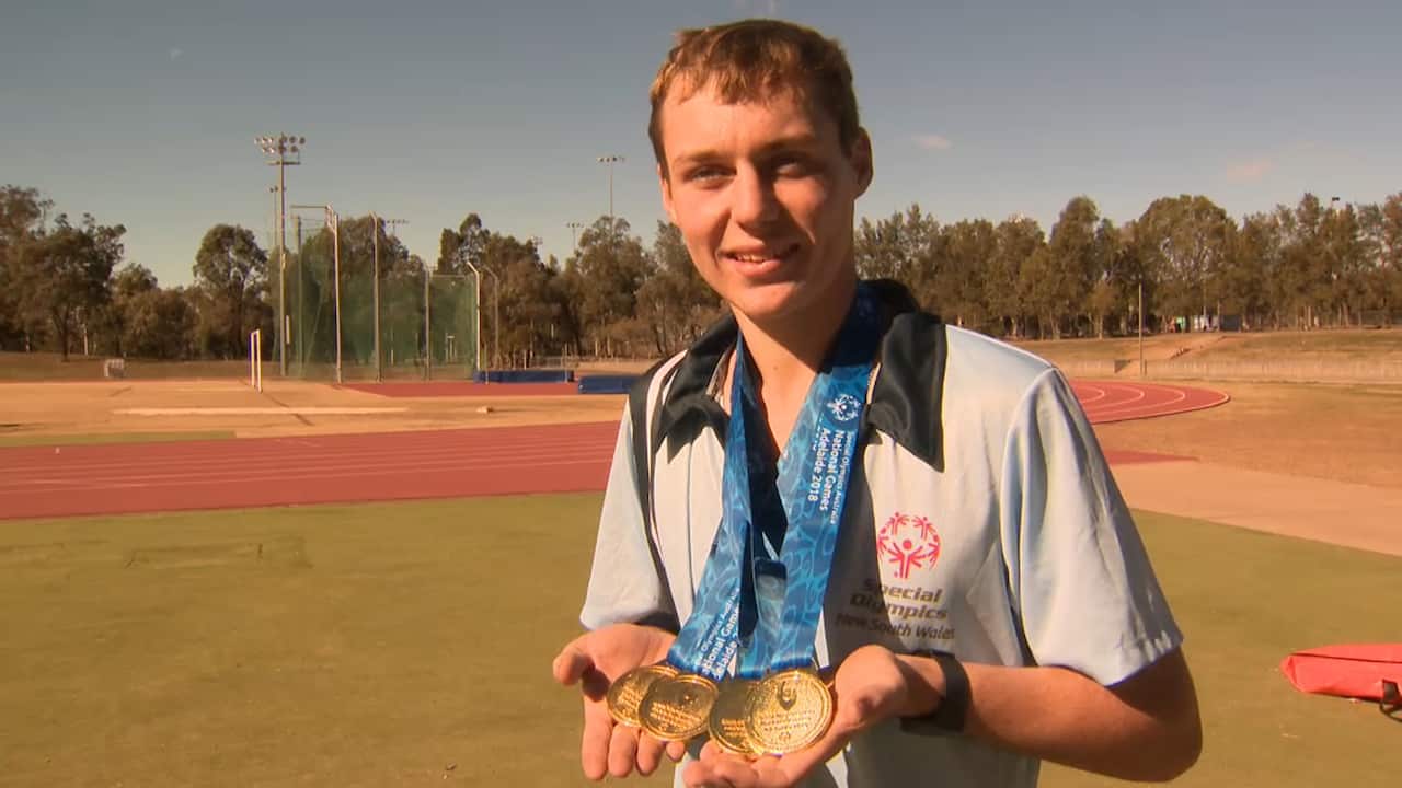 Lleyton Lloyd shows off his gold medals won at the Special Olympics national championships in Adelaide this year
