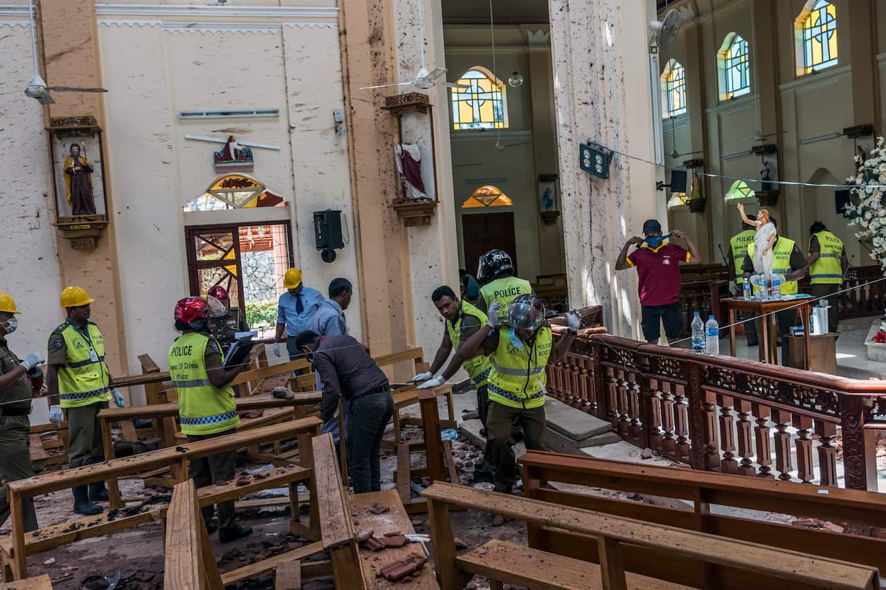 Investigators in Negombo, Sri Lanka, on Monday, April 22, 2019, at the scene of a suicide bombing at St. Sebastian Church.