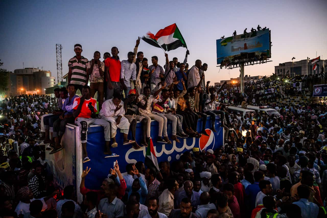 Protesters wait for speakers from the Sudan Professionals Association in Khartoum, Sudan