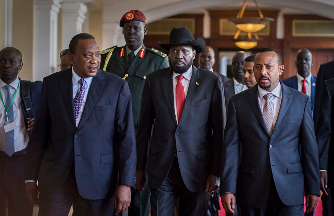 South Sudan President Salva Kiir, center, with Kenya's President Uhuru Kenyatta, left, and Ethiopia's Prime Minister Abiy Ahmed, right, during peace talks.