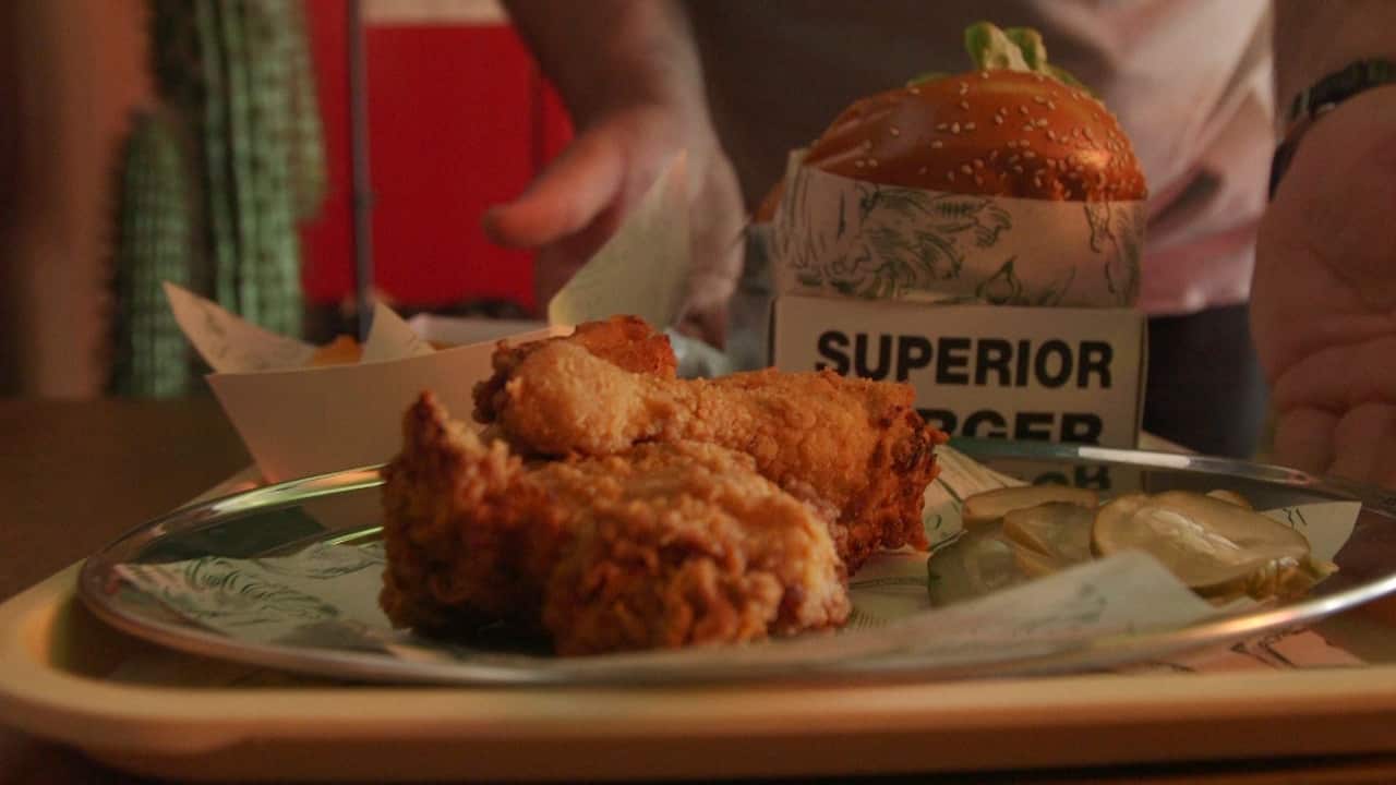 Menu items include six types of burgers, sides that include fried chicken, fries and potato scallops, as well as dessert.