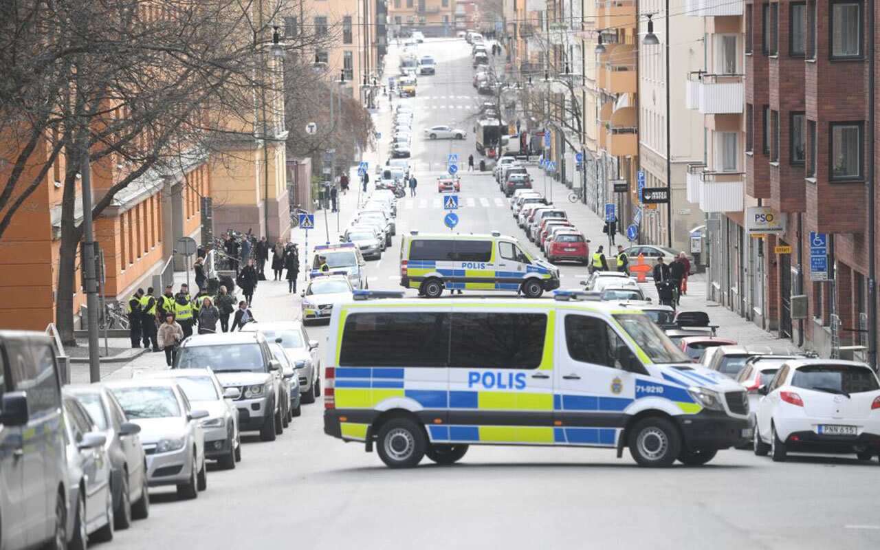 Police vans block the street outside Stockholm District Court as Rakhmat Akilov appeared in court on April 11, 2017. 