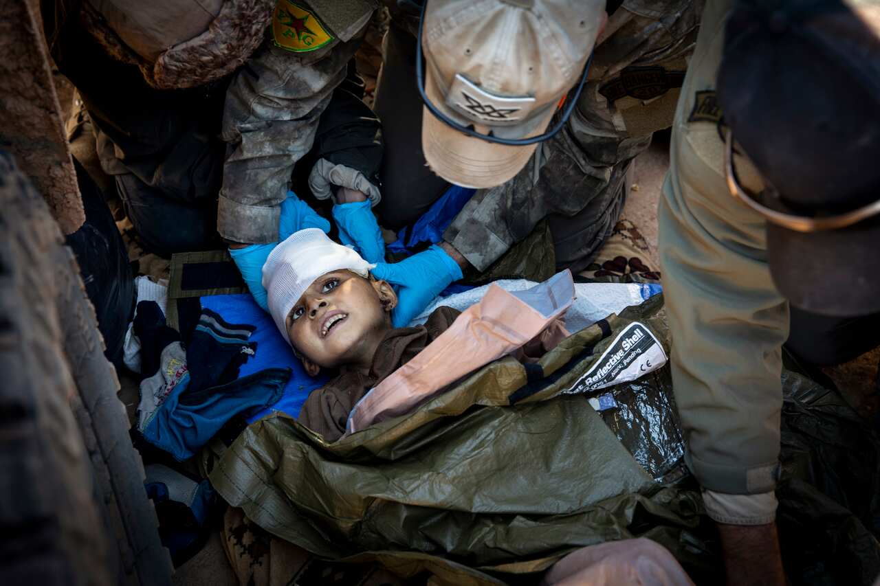 A 6-year-old boy is treated at a first aid station staffed by recently arrived American aid workers in Deir al-Zour, Syria, on Feb. 3, 2019. 