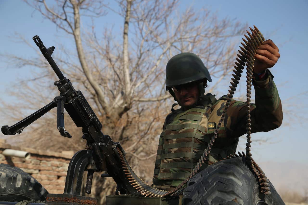 An Afghan Army soldier stands guard at a check point near the Shirzad district, in Hogyani district of Nangarhar province, Afghanistan.