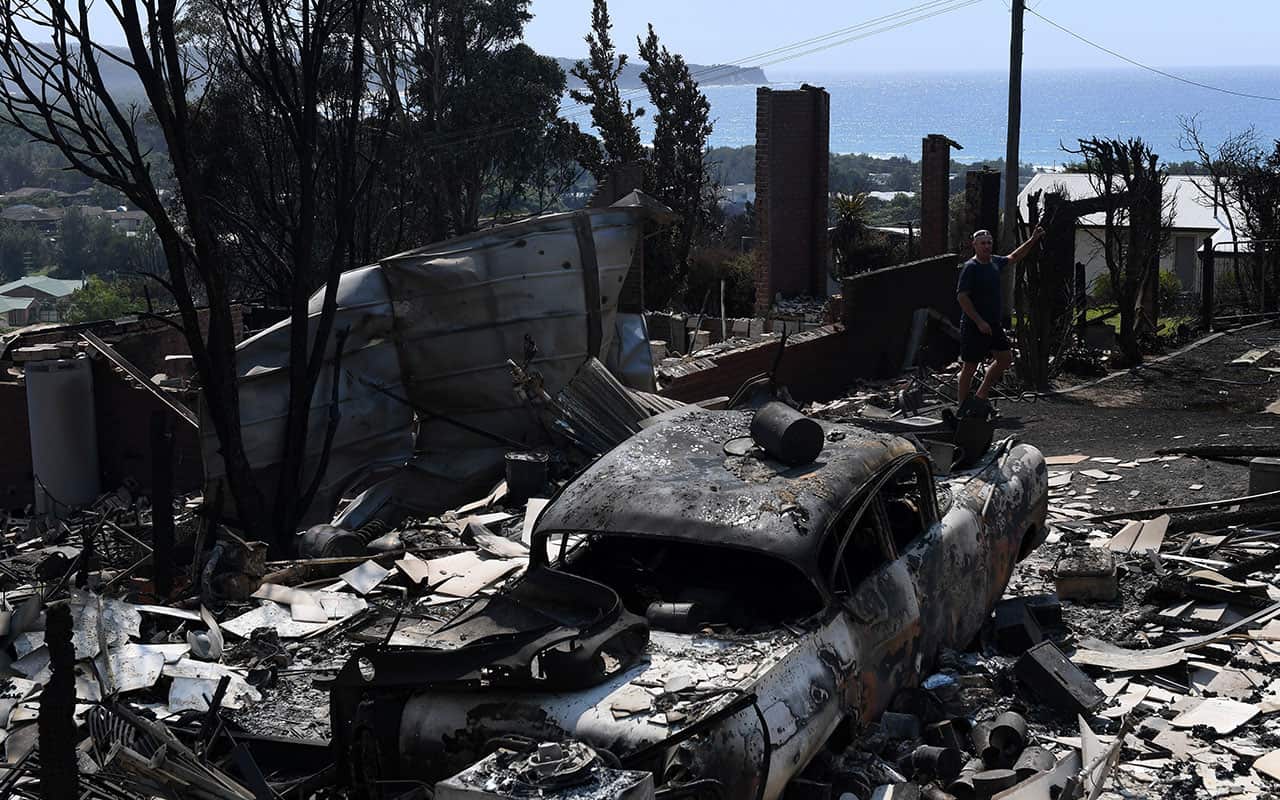 Some of the more than 70 houses and businesses destroyed by a bushfire in the coastal town of Tathra, Monday, March 19, 2018. 