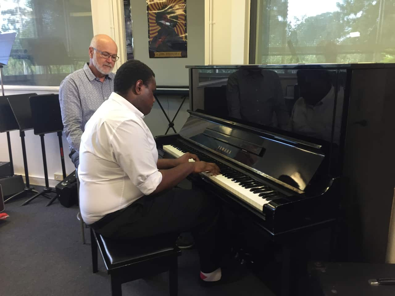 Music teach John Hibbard mentors Terry Maelaua through the Symphony for Life Foundation.