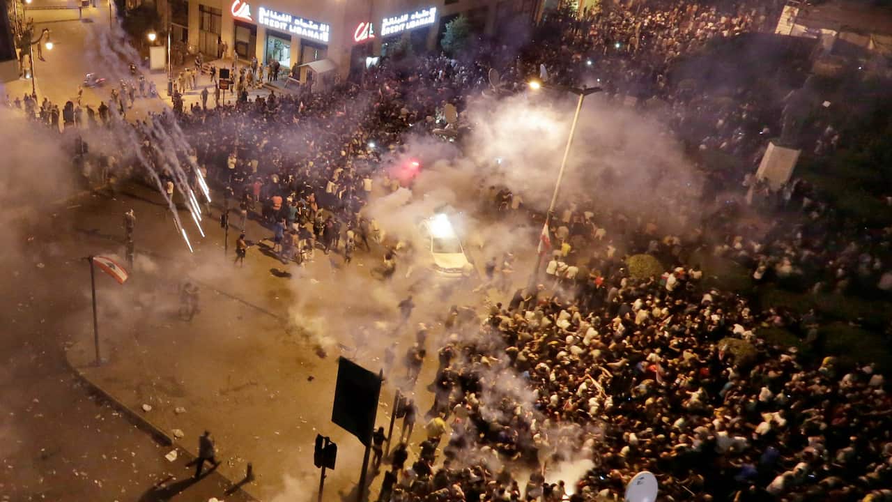 Lebanese riot police fire tear gas during a protest against government's plans to impose new taxes in Beirut, Lebanon.