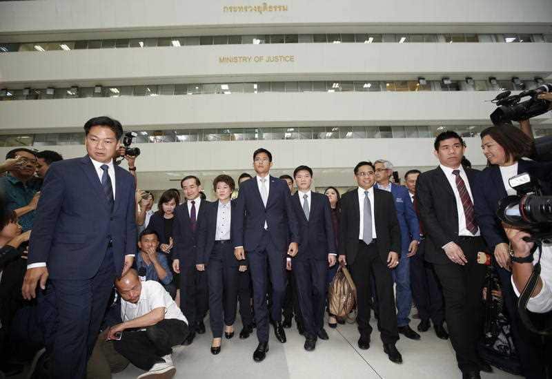 Preechapol Pongpanich (C) and other party members arrives at the Constitutional Court.