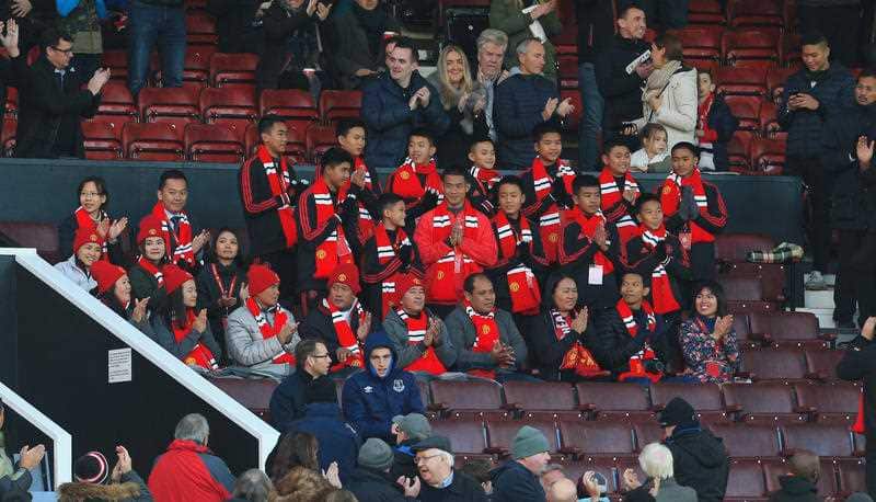 The Wild Boars football team, who were trapped in a cave before being rescued, received a round of applause before kick off.