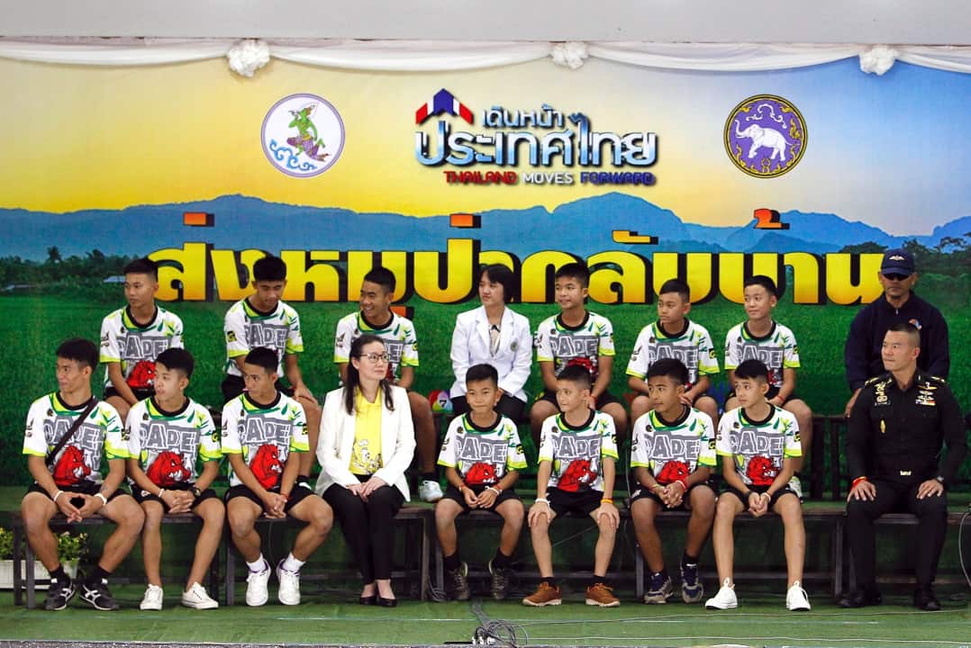 Twelve rescued members of the Wild Boar football team and their assistant coach share their story for the first time.