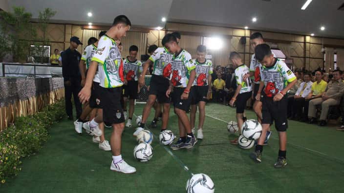 Members of the rescued football team enjoy their new-found freedom.