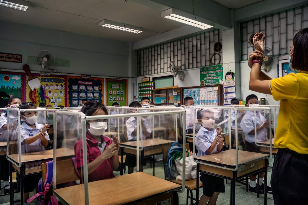 Students at Sawasdee Wittaya Primary School learn about washing hands in their first class back at school during the pandemic, in Bangkok, July 1, 2020. 