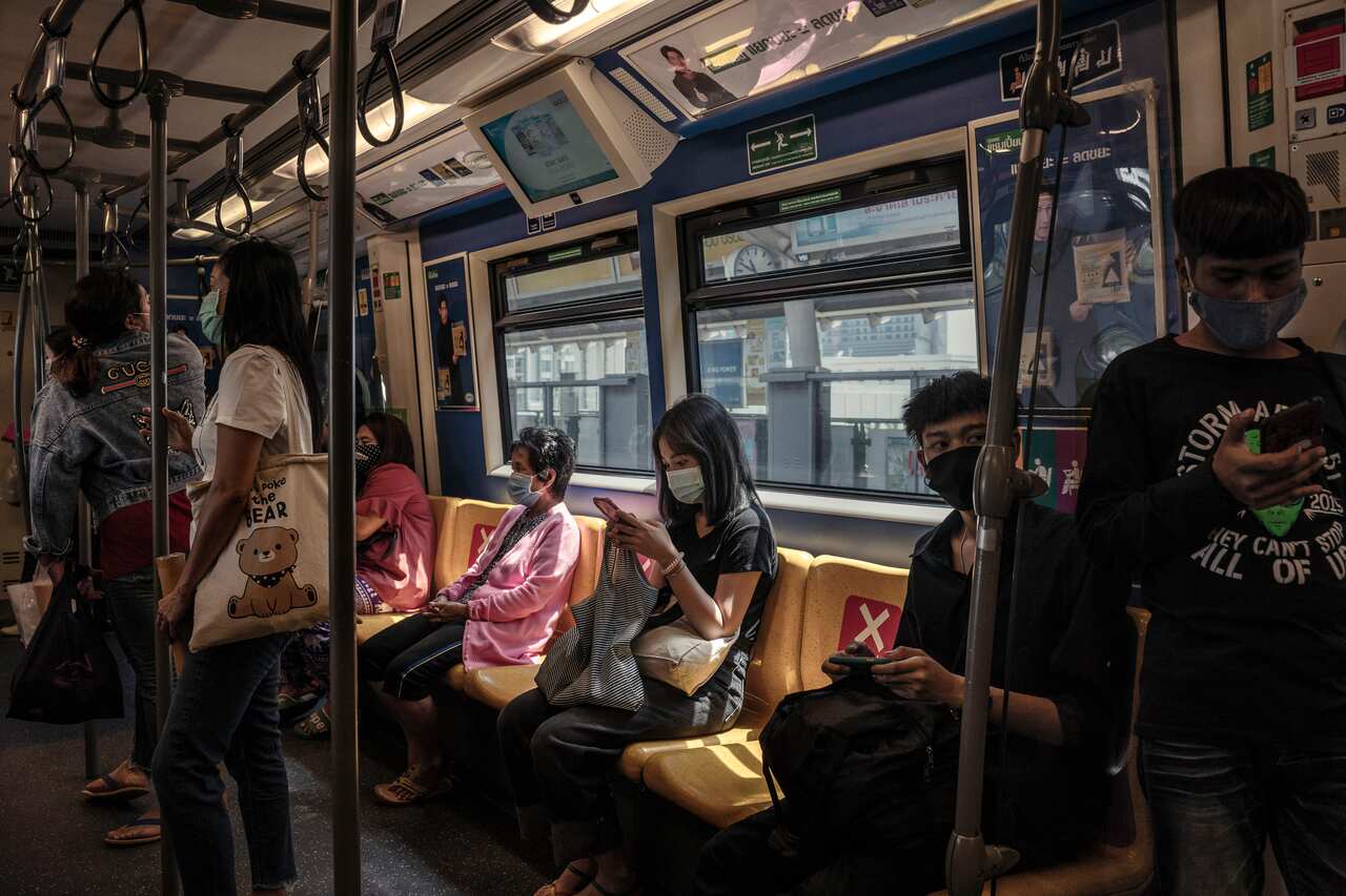 Public transit riders wearing masks, a measure quickly adopted across Thailand during the pandemic, in Bangkok, April 28, 2020. 