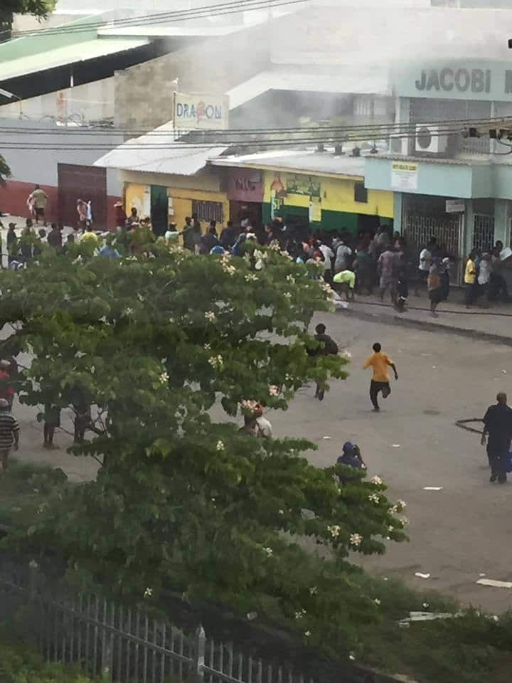 A man runs through the streets of Port Moresby